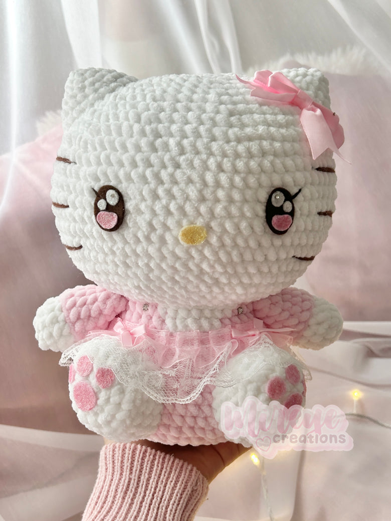 Pink Hello Kitty plush in a skirt
