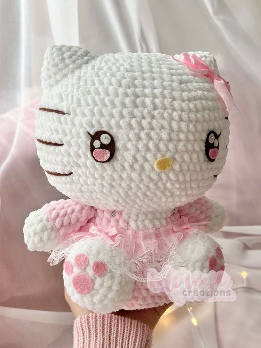 Pink Hello Kitty plush in a skirt